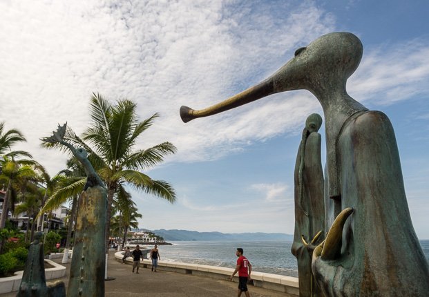 uerto Vallarta's Malecon area is a must see when visiting this destination city. Located along the Pacific Ocean front the Malecon stretches for 12 blocks, almost a mile long, and is full of spectacular artwork, shops, stands, bars and restaurants. On any day of the week you will find something happening along Puerto Vallarta's Malecon.