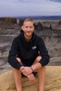 sheridan sitting on overlook in Utah