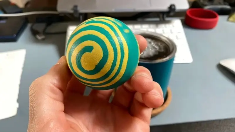 green and yellow bouncy ball